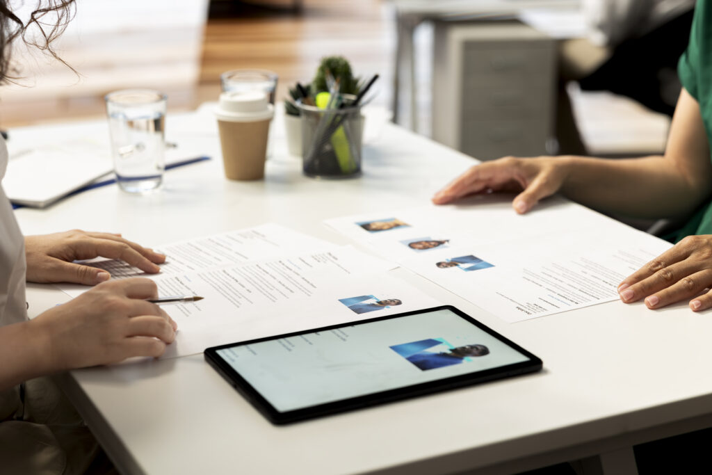 hr manager using device to evaluate if applicant qualifications match demands